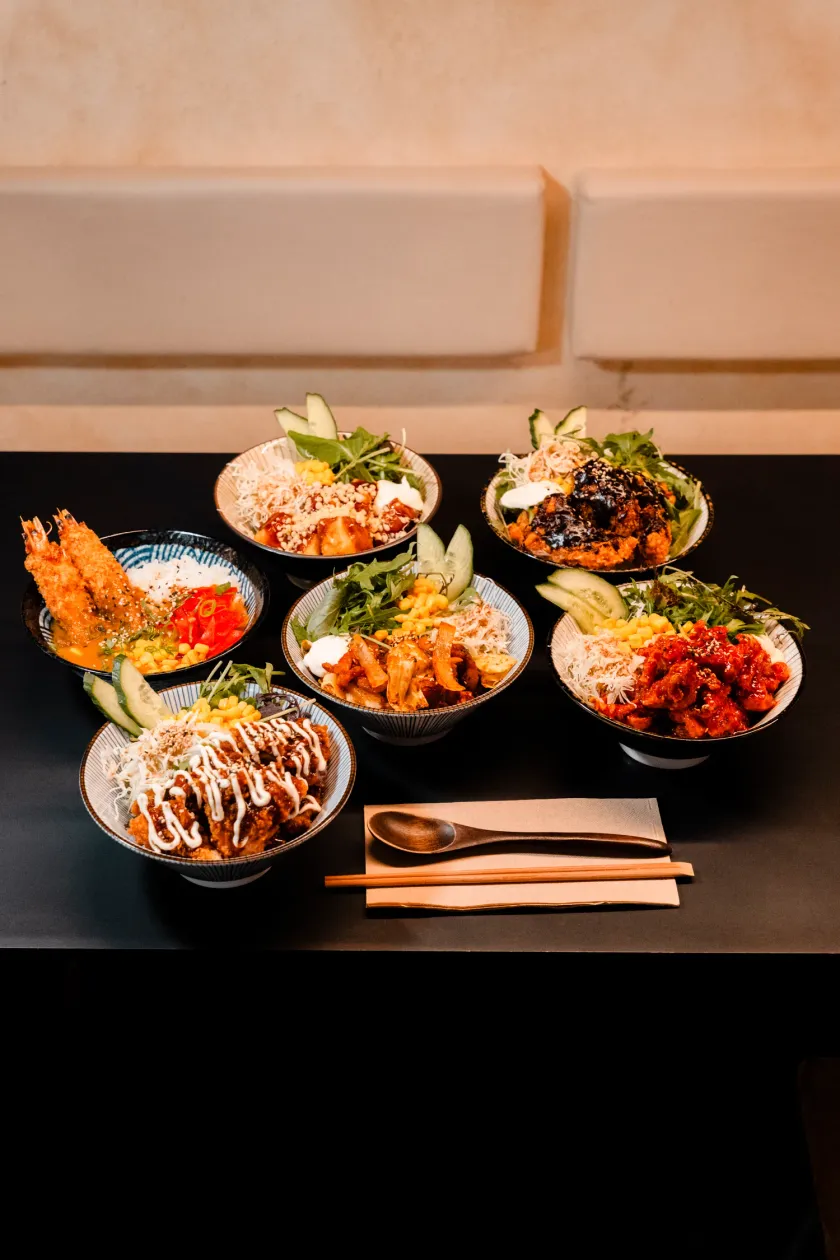WATDA express lunch bowls on a red table