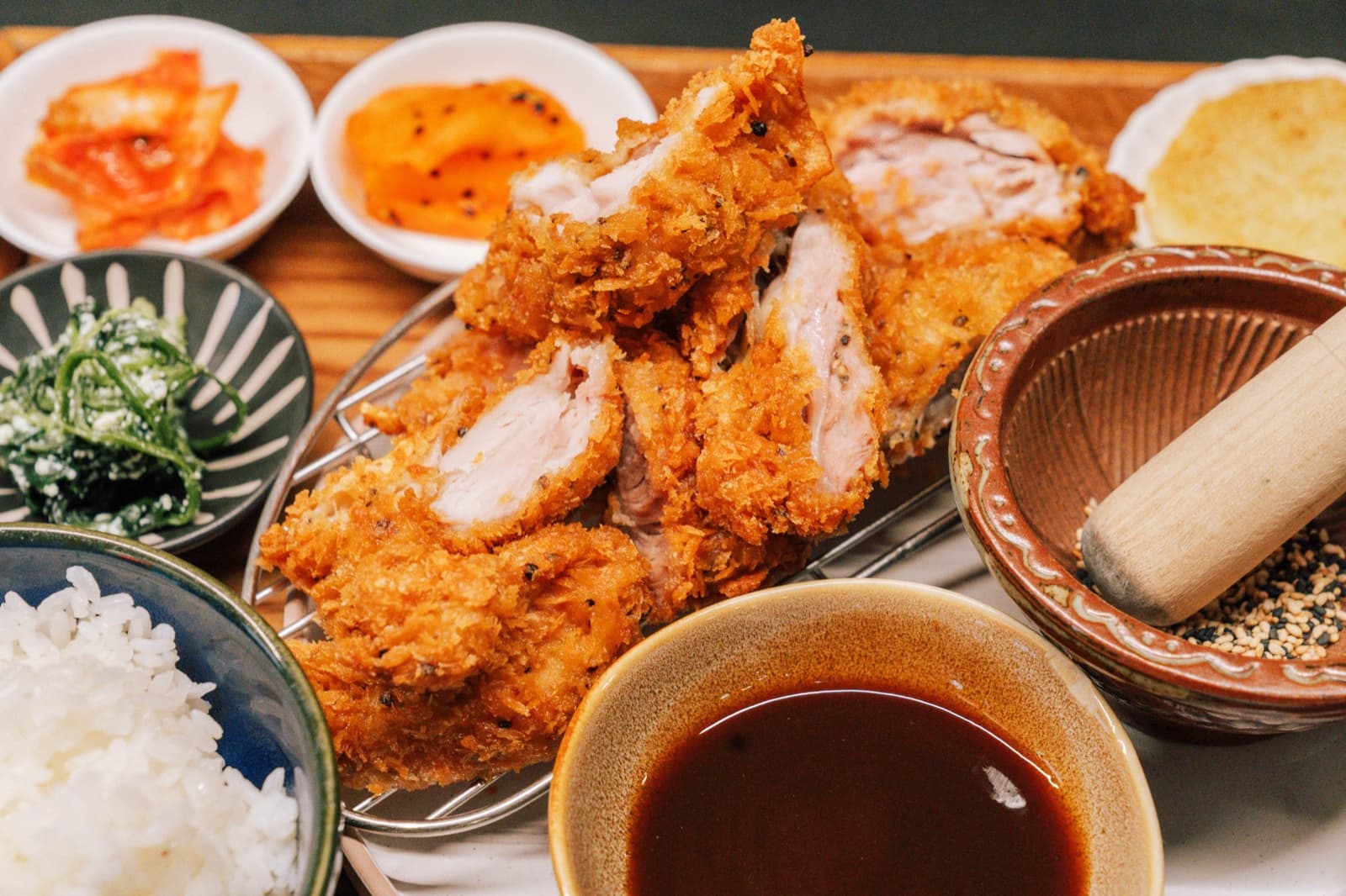 WATDA chicken katsu served with rice and Korean side dishes
